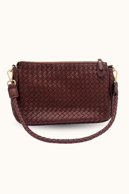 Brown woven  Modern + Chic Elle Woven Crossbody Bag for Women with gold accents on a white background.
