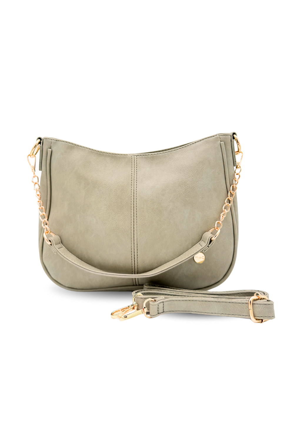A pebble or pale green Marissa Vegan Leather Saddle Crossbody Bag | Modern + Chic