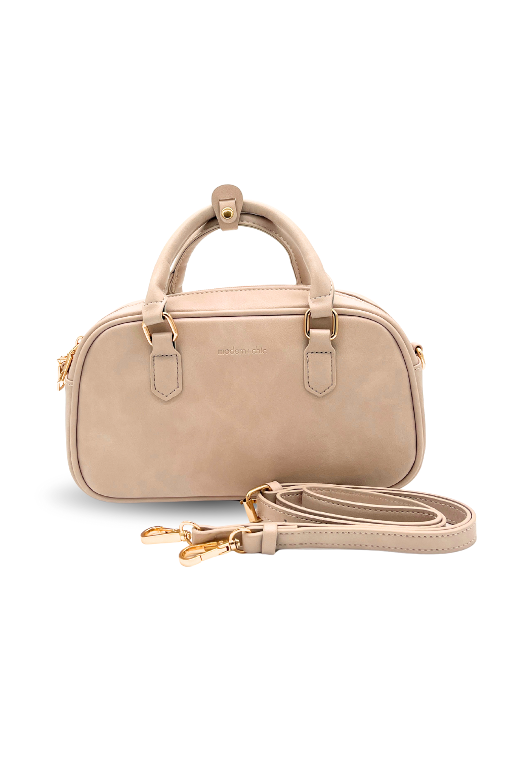 A cream Modern + Chic Remi Vegan Leather Crossbody Purse with gold hardware on white background. 

