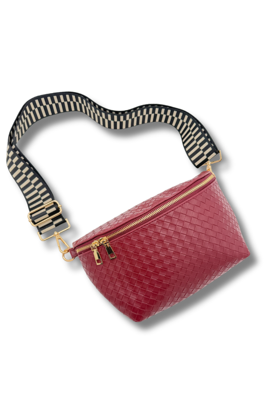 Red woven waist bag with a striped strap on a white background