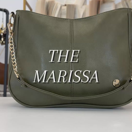 A video showing the features and benefits of a Modern + Chic Marissa Vegan Leather Crossbody Handbag with gold chain accents. 