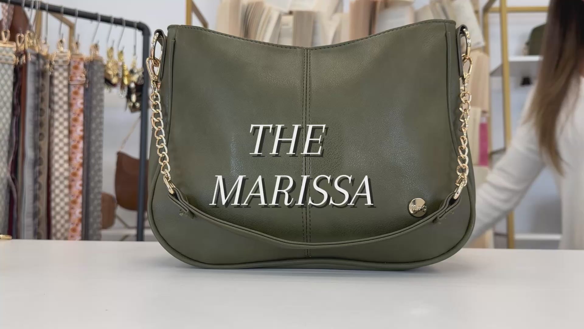 A video showing the features and benefits of a Modern + Chic Marissa Vegan Leather Crossbody Handbag with gold chain accents. 